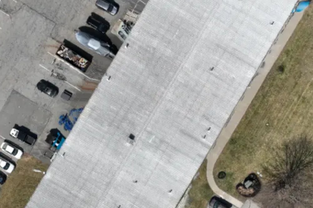 Orthomosaic of a commercial building's white membrane roof, exported without a base map